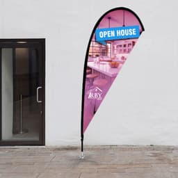 A small tear drop flag kit featuring a pink and blue design, supported by a metal base. Includes a branding logo.