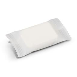 A white compressed towel packaged in a small, clear plastic wrapper. The package features a simple design.