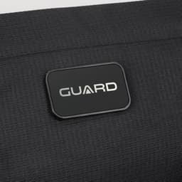 A black sling bag with a rectangular logo featuring the word "GUARD" prominently displayed.