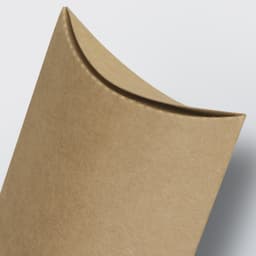 A small, brown pillow box with a curved top and seamless design, featuring a logo.