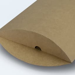 A medium-sized, kraft paper pillow box with a rounded end and a small opening for easy access.