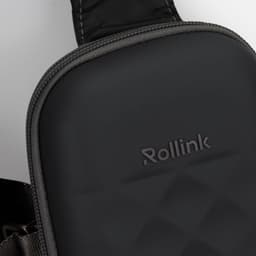 A black, textured bag with a padded surface and a strap, featuring a small logo.