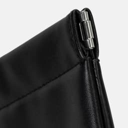 A black tech and accessory pouch with a silver zipper pull, featuring sleek stitching and a smooth finish.