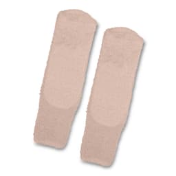 Fluffy grip socks in a soft beige colour, featuring a textured surface for added grip. Includes a logo.