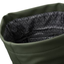A soft-touch, olive green flap backpack with a patterned black interior and a zippered pocket inside.
