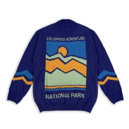 A blue knitted jumper featuring a mountain design with orange and yellow accents, and a branding logo.