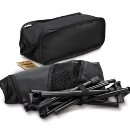 A lightweight folding chair in a black storage bag, with disassembled frame pieces visible alongside.