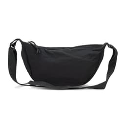 A black crossbody bag with a curved shape, featuring a zip closure and adjustable strap. It has a simple design with a logo.