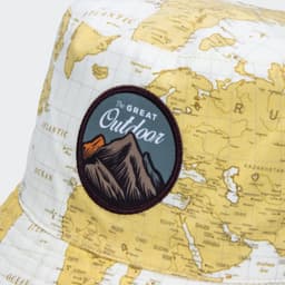 A bucket hat with a map design in yellow and a patch featuring mountains and the phrase "The Great Outdoor".