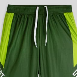 Green active pants with bright green accents, featuring a white drawstring and a logo. Ideal for sports or workouts.