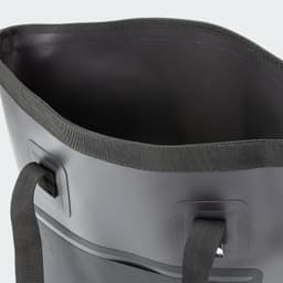 A black bucket bag with a smooth, rounded edge and side handles, featuring a sleek, minimalistic design.