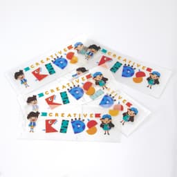 Sticker sheets featuring colourful designs and characters, showcasing vibrant lettering and playful shapes.