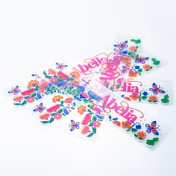 A set of colourful stickers featuring flowers and butterflies, all with a playful design on a white background.