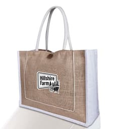 A jute bag with a natural brown finish and white handles, featuring a logo on the front.