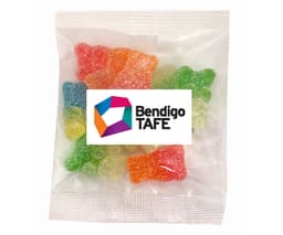 A packet of sour gummy bears in various colours including green, orange, and yellow, with a logo visible.