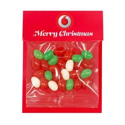 A festive red packaging containing assorted jelly beans in red, green, and white colours, featuring a logo.