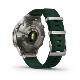 A smartwatch with a green fabric strap and silver stainless steel case, featuring a logo on the back.