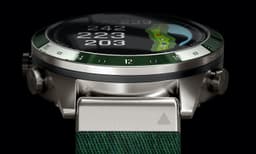 A stylish green and silver smartwatch featuring a golf course map and various measurements on the display.