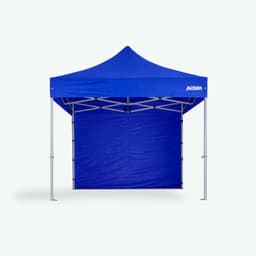 A blue gazebo with a solid wall and a peaked roof, featuring a logo on the top.