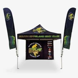 A double-sided marquee wall in black with vibrant graphics and a logo, featuring tall flags on either side.