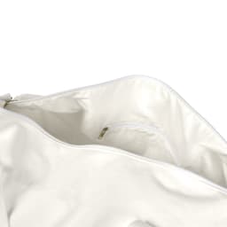 A white canvas duffel bag with a spacious interior and a small zipped pocket. It features a logo.