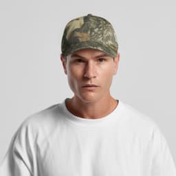 A camo cap featuring a mix of green and brown patterns, worn by a model in a white t-shirt. The cap has a logo.