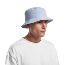 A blue nylon bucket hat with a structured brim, worn by a person in a white t-shirt. The hat features eyelets for ventilation.