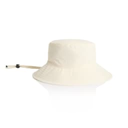 A cream nylon wide brim bucket hat with an adjustable chin strap and a rounded top.