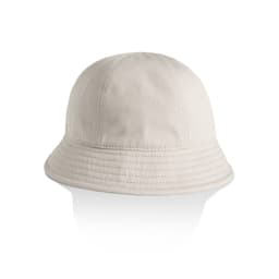 A beige bucket hat with a wide brim and stitched detailing, featuring a branding logo.