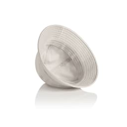 A light beige bucket hat with a wide brim and a logo inside. It rests on a reflective surface.