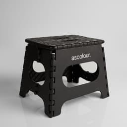 A black ASC Utility Stool with a textured surface and cut-out handles, featuring a logo on one side.