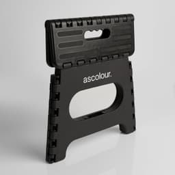 A black folding stool with a textured surface and a handle, featuring a logo on the front.