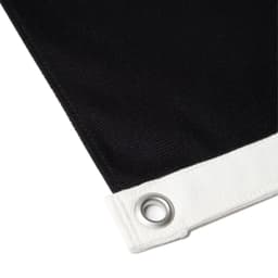 A black canvas flag featuring a white hem and grommet for secure hanging.