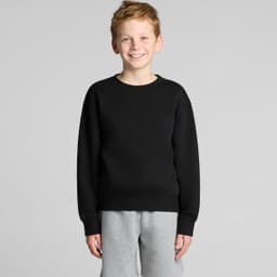 A black jumper featuring a round neckline and long sleeves, worn by a smiling boy with light brown hair.