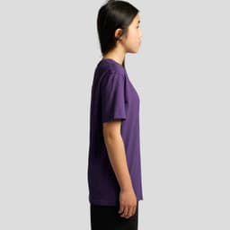 A purple youth t-shirt displayed on a model in profile view, featuring a simple design and short sleeves.