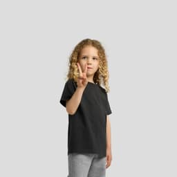 A black heavy faded tee for kids, featuring a relaxed fit and a logo on the front.