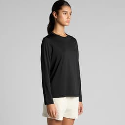 A black long-sleeve T-shirt displayed on a model, paired with light-coloured shorts. The shirt features a logo.