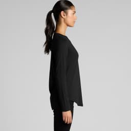 A long-sleeve tee in black, featuring a modern cut and side view of a model. The shirt has a minimalist design.