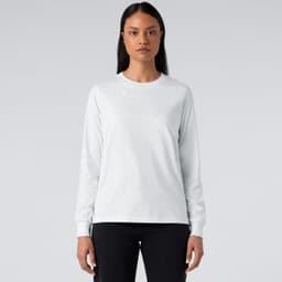 A long-sleeve white T-shirt featuring a fitted design, paired with dark jeans. It has a logo on the front.