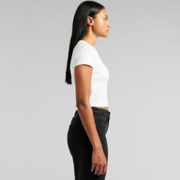 A white short-sleeve T-shirt displayed on a model, paired with black jeans, showcasing a side profile view.
