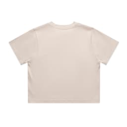 A light beige crop tee with short sleeves and a simple design. Features a logo on the back.