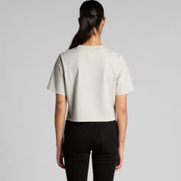A cropped, faded tee in light grey, displayed from the back, with a plain design and short sleeves.