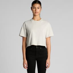 A light grey cropped t-shirt with short sleeves, worn by a model with black jeans. The shirt features a logo.