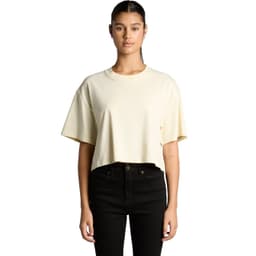 A cropped tee in a soft yellow colour, featuring short sleeves and a relaxed fit. Includes branding on the shirt.
