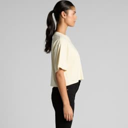 A side view of a cropped tee in pale yellow, featuring short sleeves and a relaxed fit.