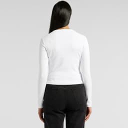 A white long-sleeve tee with a fitted design, featuring a logo on the back, worn with black pants.
