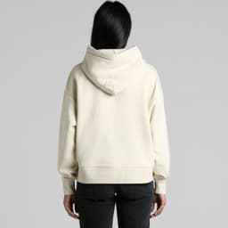 A cream-coloured hoodie with a large hood, featuring a relaxed fit and long sleeves. It has a logo on the back.