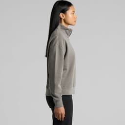A faded grey half zip jacket with a collar and long sleeves, featuring a logo on the chest.