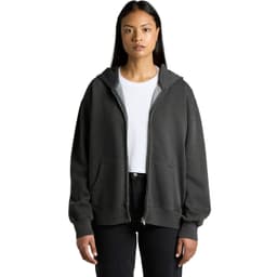 A woman wearing a faded dark grey zip hoodie, featuring a front pocket and a logo.