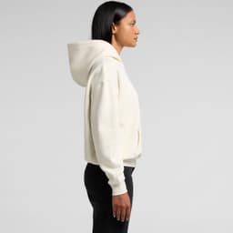 A cream-coloured hoodie with a hood, featuring a loose fit and a front pocket. It has a logo on the garment.